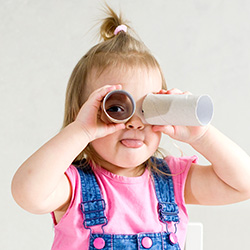 girl looking through binoculars