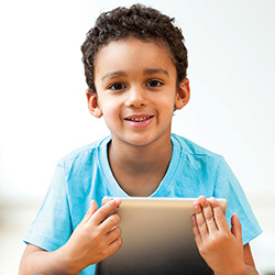 boy holding ipad