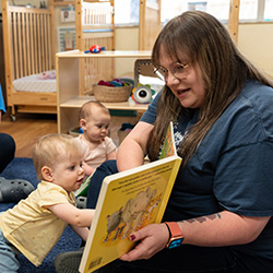 teacher reading to children in the infants classroom