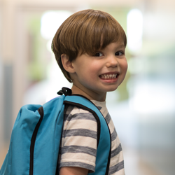 boy with backpack on