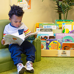 child reading on couch