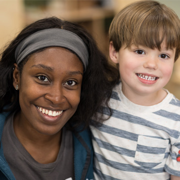 teacher and student smiling