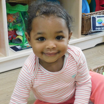 infant girl smiling
